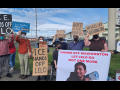 Supporters gather at a rally demanding Alfredo's release with signs reading "ICE Hands off Lelo", "Chinga la Migra" and other statements in solidarity with Lelo.