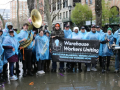 Bergen logistics workers and supporters gather in blue rain ponchos. 